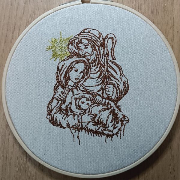 Bastidor com bordado em castanho e dourado do presépio.