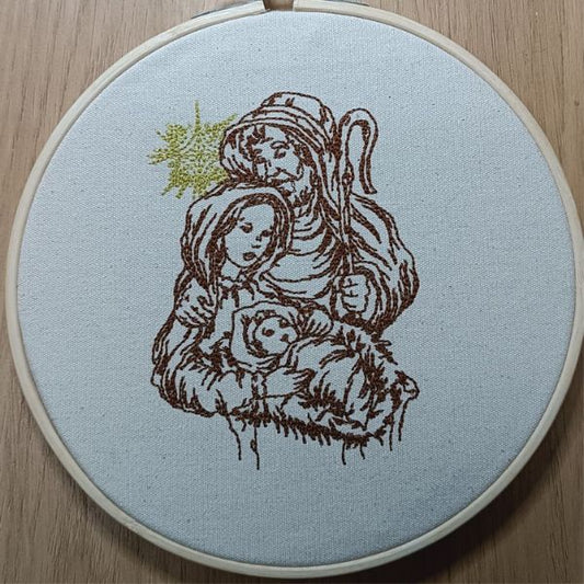 Bastidor com bordado em castanho e dourado do presépio.